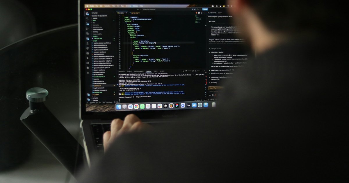 Developer reviewing source code on a laptop