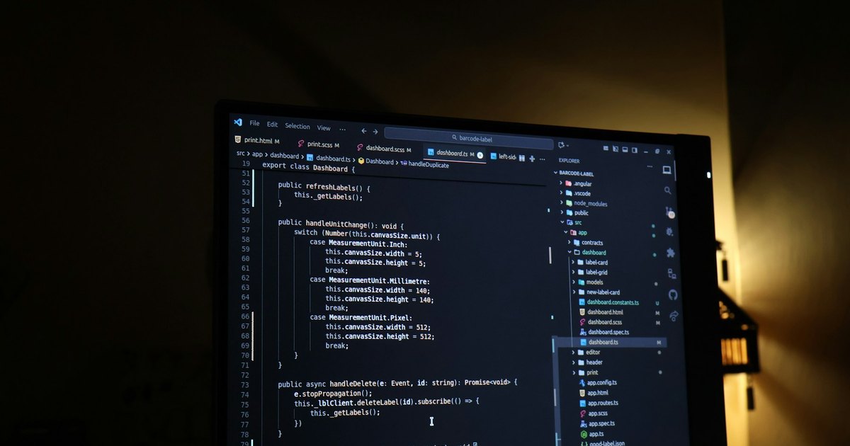 Code editor open on a monitor during software testing