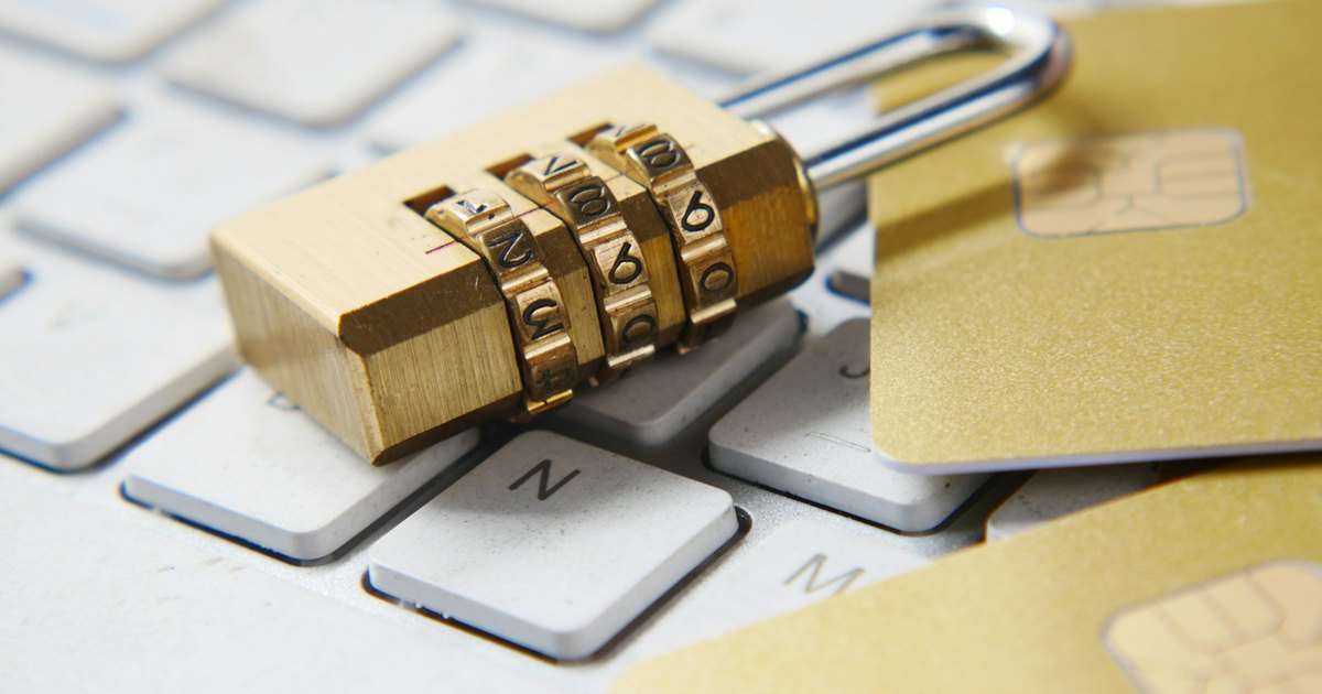Padlock resting on a keyboard representing secret protection