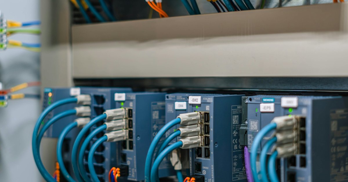 Network switch and blue cables representing infrastructure
